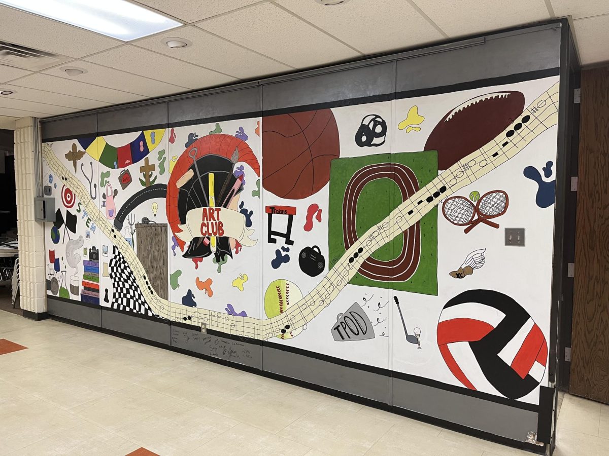 This mural, located outside the art room, was painted by last years Art and Photo Club members with the assistance of community artist Maddi Sutter.