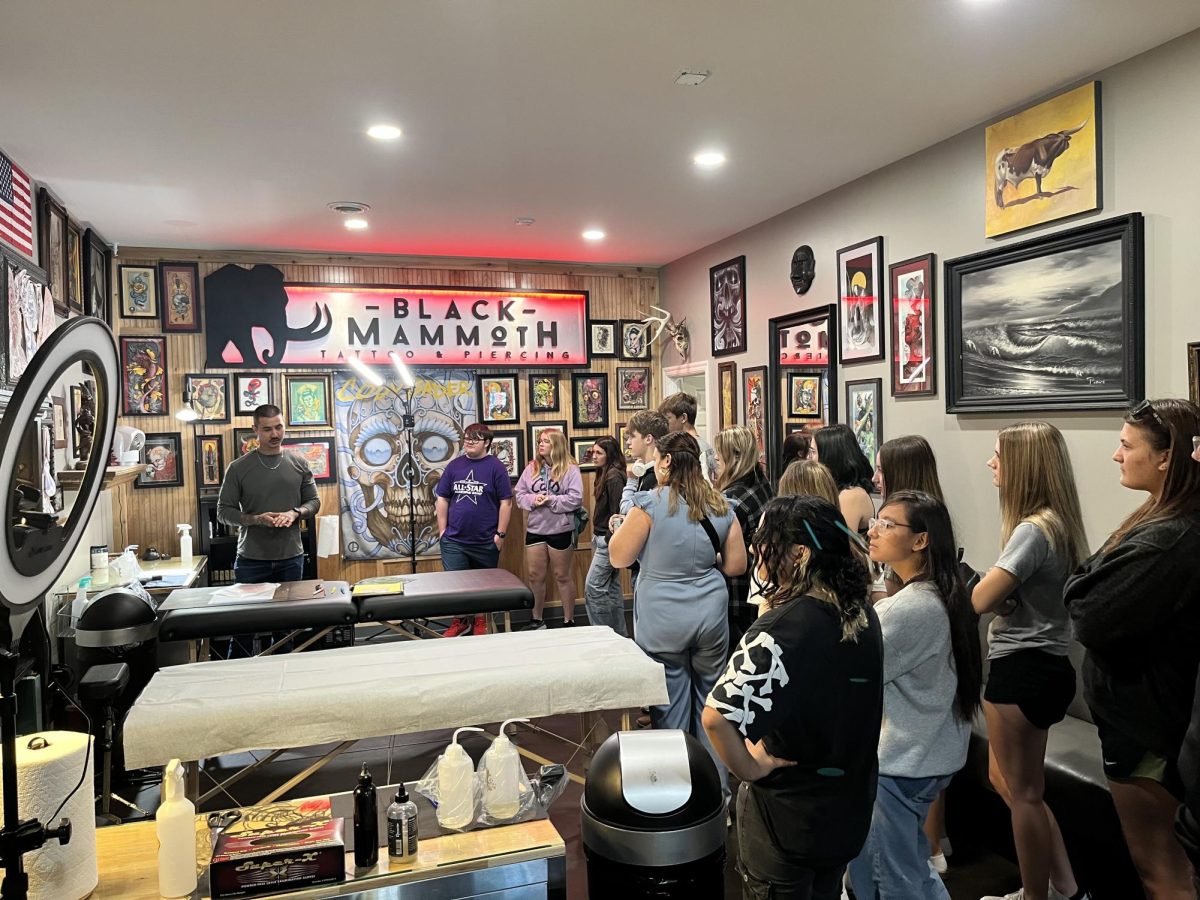 Art and Photo Club visits museum, tattoo artist